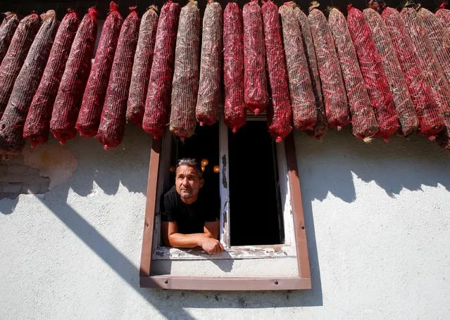 Peter Szabo, who runs a business producing powdered paprika, one of Hungary's best-known staples, looks out a window in Batya, Hungary, September 26, 2016. (Photo by Laszlo Balogh/Reuters)
