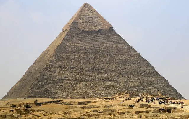 Local and foreign tourists visit the Pyramid of Khufu, the largest of the Great Pyramids of Giza, on the outskirts of Cairo, Egypt, November 8, 2015. Egypt's Tourism Minister Hesham Zaazou said Cairo regretted the suspension of flights and was doing all it could to secure its airports and tourist sites. (Photo by Amr Abdallah Dalsh/Reuters)