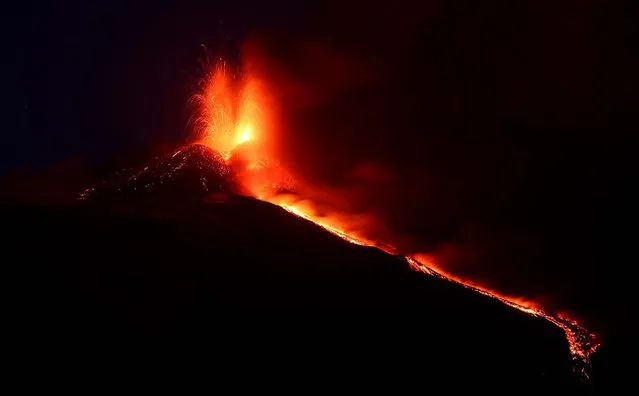 Lava flows during an eruption of Mt. Etna as seen from the village of Acireale, near the Sicilian town of Catania, Italy, on April 27, 2013. (Photo by Carmelo Imbesi/Associated Press)