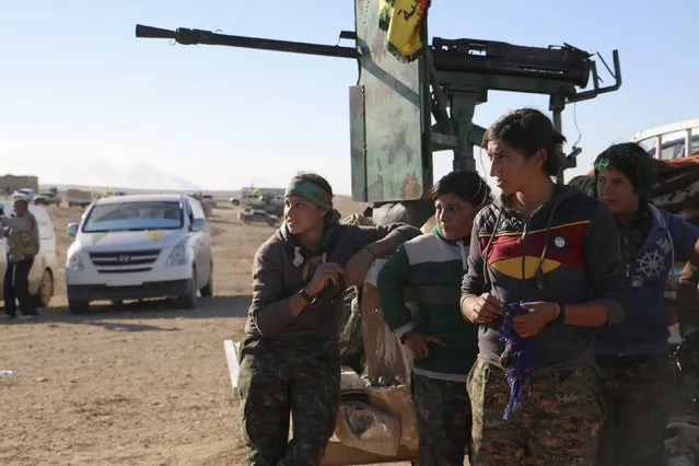 Kurdish female fighters from the People's Protection Units (YPG), who are fighting alongside with the Democratic Forces of Syria, gather near the Syrian town of al Houl in Hasaka province, after they took control of the area, November 14, 2015. (Photo by Rodi Said/Reuters)