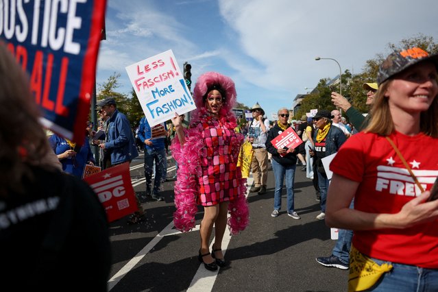 A demonstrator holds a placard during a “No Kings” protest against U.S. President Donald Trump's policies, in Washington, D.C., U.S., October 18, 2025. (Photo by Kylie Cooper/Reuters)