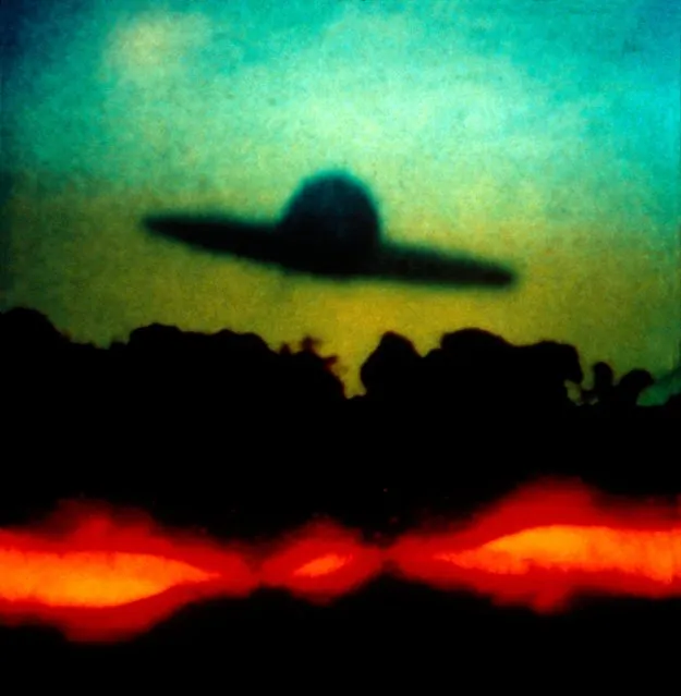 “Soft Landing” by Oliver Wasow, 1987. The stock-in-trade of supermarket tabloids, images of UFOs test the relationship between photography and belief. In Soft Landing, as in his many other images of mysteriously floating disks and orbs, Wasow courts doubt by distorting found images, running them through a battery of processes, including photocopying, drawing, and superimposition. (Photo courtesy of The Metropolitan Museum of Art)