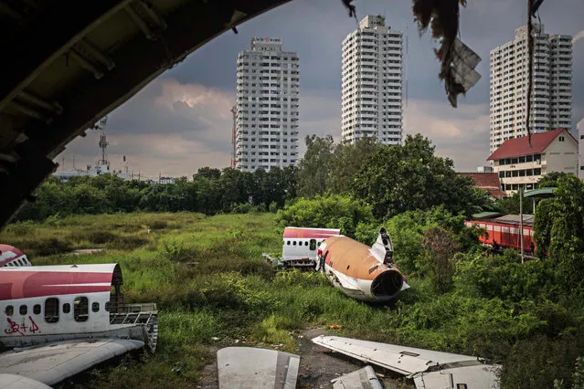 The lot contains several abandoned airplane fuselages, and is surrounded by high-rise flats. (Photo by Lauren DeCicca/The Guardian)