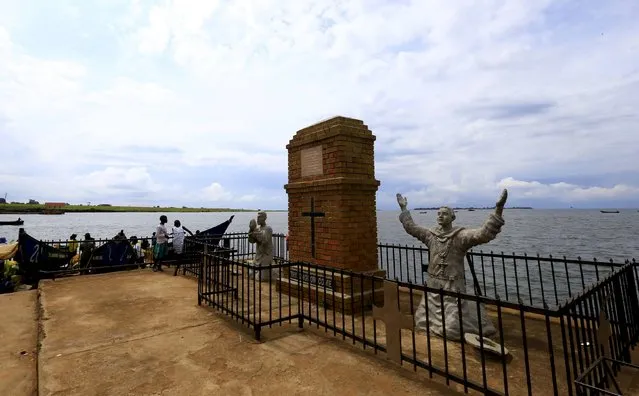 A statue of the first catholic missionaries of French origin is seen on the shore of Lake Victoria, marking the spot where Father Simeon Lourdel and Brother Amans landed 136 years ago, in Kigungu, near Entebbe international airport, south of Uganda's capital Kampala October 18, 2015. (Photo by James Akena/Reuters)