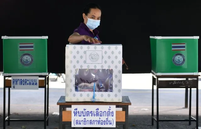 A woman casts her vote at a polling station during provincial elections in Chonburi province in Thailand, December 20, 2020. (Photo by Chalinee Thirasupa/Reuters)