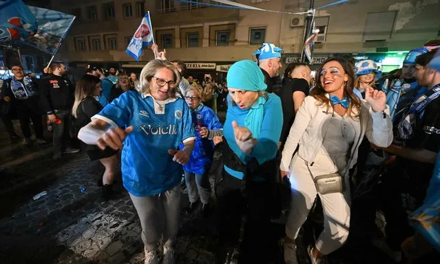Fans of SSC Napoli celebrate on May 4, 2023 in Naples after Napoli won the Italian champions “Scudetto” title after a decisive match in Udine. (Photo by Alberto Pizzoli/AFP Photo)