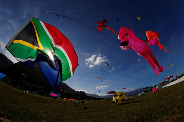 Kites of all shapes and sizes fill the air at the 22nd Cape Town International Kite Festival in Cape Town, South Africa, October 29, 2016. (Photo by Mike Hutchings/Reuters)