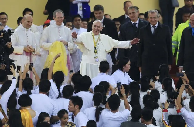 Pope Francis gestures during a meeting with the youth at the University of Santo Tomas in Manila January 18, 2015. (Photo by Romeo Ranoco/Reuters)