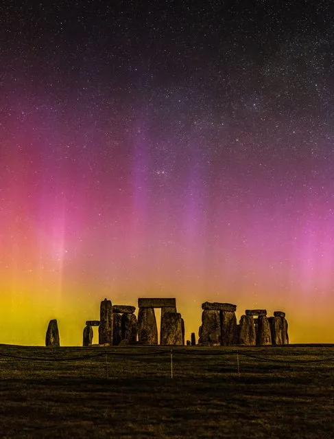 Pictured in the early hours of Friday morning, March 24, 2023 are the northern lights over Stonehenge in Wiltshire. The aurora was very strong with a dazzling light display with light pillars captured. (Photo by Nick Bull/Picture Exclusive)
