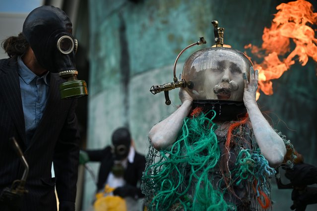 Ocean Rebellion demonstrators perform on the Albert Embankment, on the final day of the MEPC 82 meetings in London, UK on October 2, 2024. (Photo by Victoria Jones/Rex Features/Shutterstock)