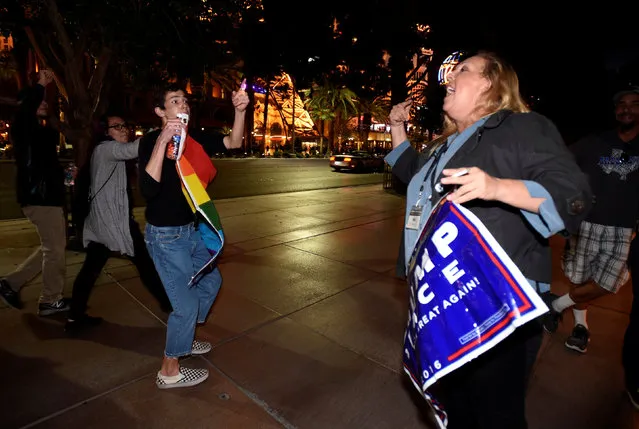 Pino Alessi (L) of Las Vegas argues with a Donald Trump supporter during a protest march against the election of Trump as President of the United States, along the Las Vegas Strip in Las Vegas, Nevada, U.S. November 9, 2016. (Photo by David Becker/Reuters)
