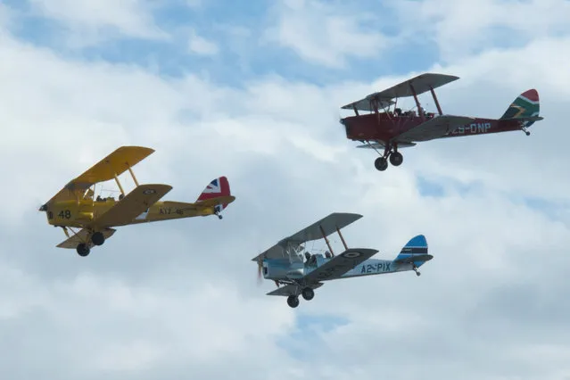 Biplanes representing Britain, Botswana and South Africa fly during the start of the Vintage Air Rally over the airport of Sitia on the island of Crete, Greece, November 11, 2016. (Photo by Beatrice de Smet/Reuters/Vintage Air Rally)