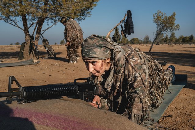 A YPJ fighter sharpens her weapon skills in a remote training camp on December 25, 2024 in Al-Hasakah, Syria. Kurdish female fighters are expanding their ranks on the frontlines and elsewhere in the fight against Islamic State and Turkish back militants in northeastern Syria. YPJ and YPG fighters receive intensive weapon and ideology training for several weeks before they start their posting. (Photo by Elke Scholiers/Getty Images)