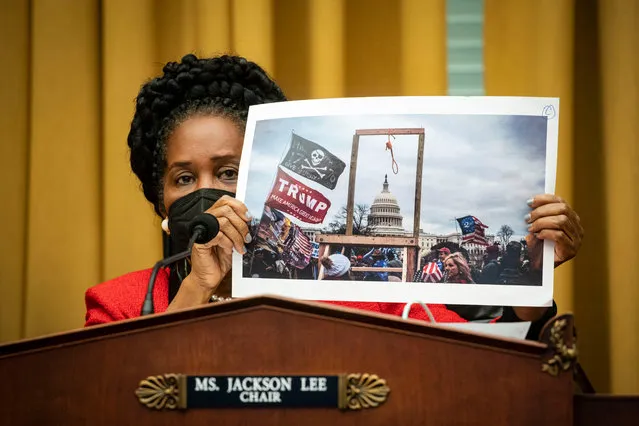 Subcommittee chair Sheila Jackson Lee (D-TX) shows a photograph from the January 6 attack on the U.S. Capiotol, during a House Judiciary subcommittee on Crime, Terrorism, and Homeland Security hearing, on Capitol Hill on February 24, 2021 in Washington, DC. (Photo by Al Drago/Getty Images)