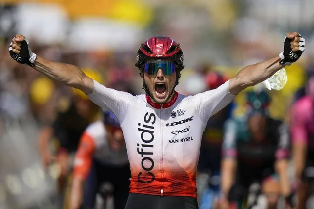 France's Victor Lafay crosses the finish line to win the second stage of the Tour de France cycling race over 209 kilometers (130 miles) with start in Vitoria Gasteiz and finish in San Sebastian, Spain, Sunday, July 2, 2023. (Photo by Daniel Cole/AP Photo)