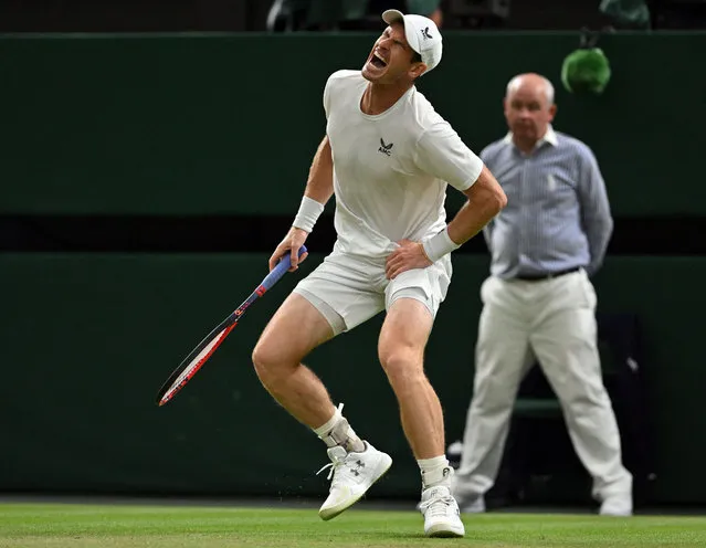 Britain's Andy Murray reacts as he plays against Greece's Stefanos Tsitsipas during their men's singles tennis match on the fourth day of the 2023 Wimbledon Championships at The All England Tennis Club in Wimbledon, southwest London, on July 6, 2023. (Photo by Glyn Kirk/AFP Photo)