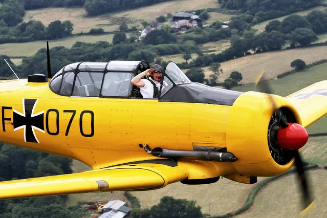 Flying instructor Jim Greenshields who hopes to break his own world record for flying the most fixed wing aircraft solo in one day. Jim will attempt to beat the current record of 43 by flying more than 50 aircraft to 2000ft and back at Dunkeswell aerodrome in Devon, England on August 4, 2018. (Photo by Jason Bryant/APEX News)