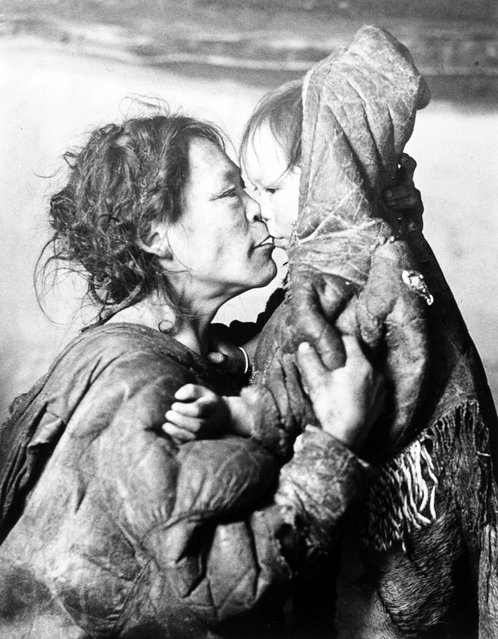"Inuit Mother Caresses Her Child in Igloo, Padleimut Tribe, N.W.T.," by Canadian photographer Richard Harrington, 1950. (Photo by Richard Harrington)