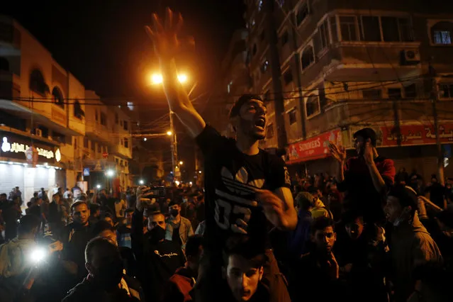 Protesters chant anti Israel slogans during a protest in solidarity with fellow Palestinian worshippers in Jerusalem, at the main street of Shati refugee camp in Gaza City, Saturday, April 24, 2021. (Photo by Adel Hana/AP Photo)