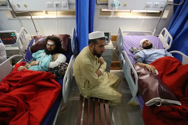 Injured people receive medical treatment a day after a suicide bomb blast targeted a gathering of Islamic political party Jamiat Ulma-e-Islam (JUI-F) in Khar, Bajaur district, at a hospital in Peshawar, Pakistan, 31 July 2023. At least 44 people were killed and dozens were injured in a suicide bomb attack that targeted a workers' convention of the Islamic political party Jamiat Ulema-e-Islam (JUI-F) in Khar on 30 July 2023, police said. (Photo by Bilawal Arbab/EPA/EFE/Rex Features/Shutterstock)