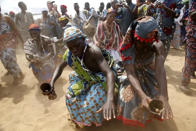 Devotees perform at the annual voodoo festival in Ouidah in Benin, January 10, 2016. (Photo by Akintunde Akinleye/Reuters)