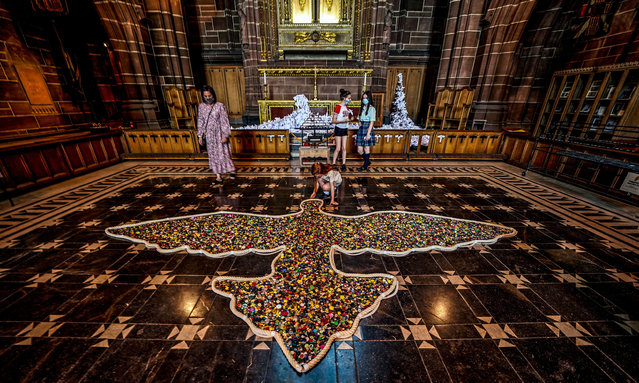 Part of the Peace Doves art installation at Liverpool Cathedral in Liverpool, United Kingdom, visitors are asked to place a button in a dove on the floor in memory of people who have died in the past year. (Photo by Peter Byrne/PA Wire Press Association)