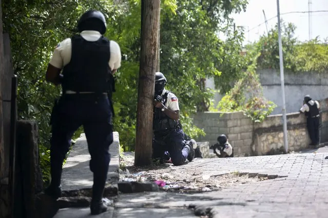 Police search the Morne Calvaire district of Petion Ville for suspects who remain at large in the murder of Haitian President Jovenel Moise in Port-au-Prince, Haiti, Friday, July 9, 2021. Moise was assassinated on July 7 after armed men attacked his private residence and gravely wounded his wife, first lady Martine Moise. (Photo by Joseph Odelyn/AP Photo)
