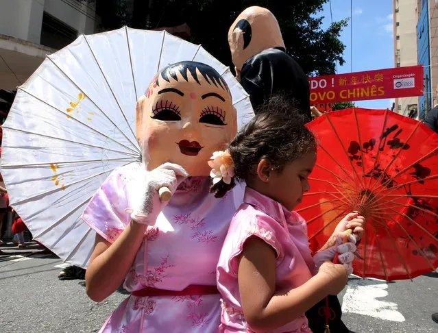 Members of the Chinese community perform during celebrations to mark the Chinese Lunar New Year, which welcomes the Year of the Monkey, in Sao Paulo, Brazil, February 13, 2016. (Photo by Paulo Whitaker/Reuters)