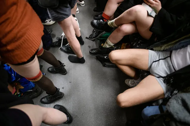 People wearing no pants participate in the worldwide event “No Pants Subway Ride” in Berlin, Germany, January 13, 2019. (Photo by Clemens Bilan/EPA/EFE/Rex Features/Shutterstock)