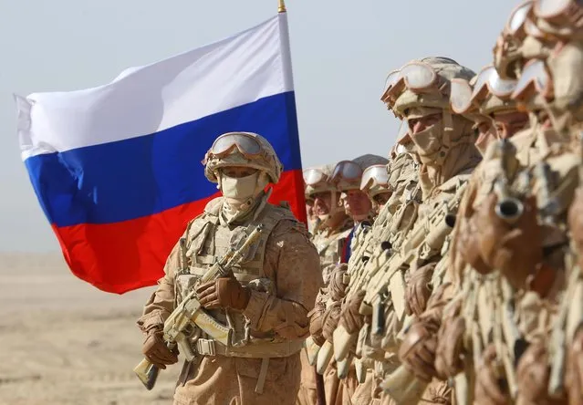 Russian troops line up before the start of joint military drills by Tajikistan and Uzbekistan at Harb-Maidon firing range about 20 kilometers (about 12 miles) north of the Tajik border with Afghanistan, in Tajikistan, Tuesday, August 10, 2021. (Photo by Didor Sadulloev/Reuters)