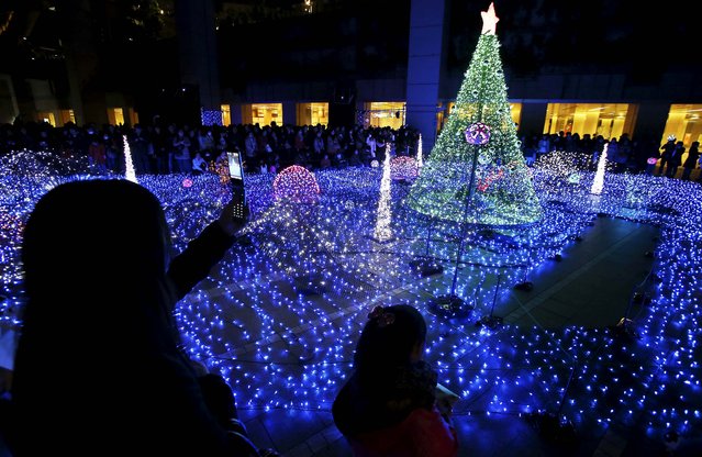 People gather to watch Illuminations during a seasonal event in Tokyo. (Photo by Koji Sasahara/Associated Press)