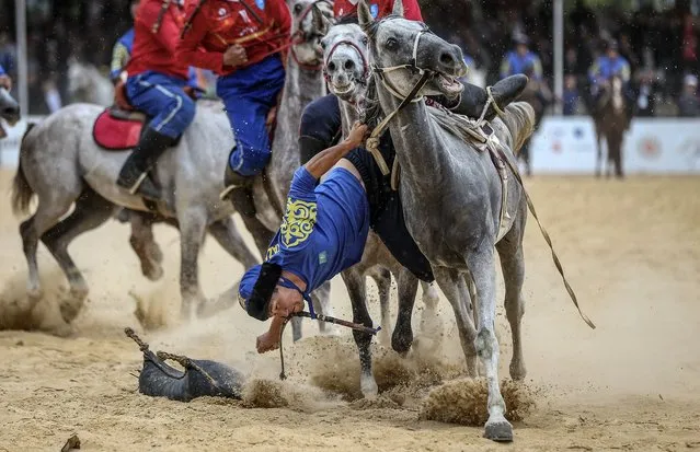 Horse riders of Kazakhstan and Kyrgyzstan compete during the final match of Kokboru competition within the 4th World Nomad Games held under the leadership of the World Ethnosport Confederation at lakeside town of Iznik, in Bursa, Turkiye on October 02, 2022. (Photo by Emin Sansar/Anadolu Agency via Getty Images)