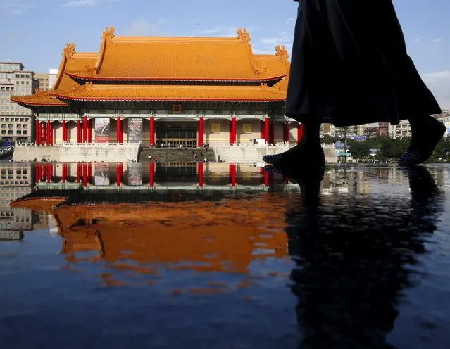 A woman walks past the the National Concert Hall in Taipei, Taiwan, January 17, 2016. (Photo by Olivia Harris/Reuters)