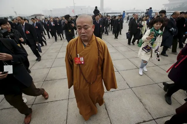 Buddhist abbot Shi Yongxin, a delegate of the National People's Congress (NPC), walks towards the Great Hall of the People for a plenary meeting of the NPC, China's parliament, in Beijing, China, March 4, 2016. (Photo by Jason Lee/Reuters)