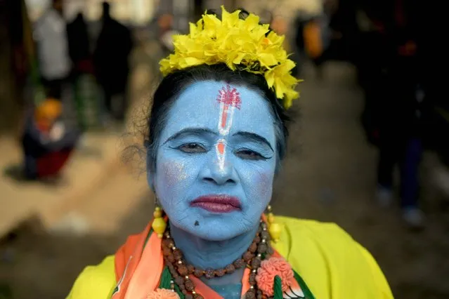 A devotee dresses as Hindu deity Lord Ram, in Ayodhya on January 22, 2024. India's Prime Minister Narendra Modi inaugurated the temple on January 22 that embodies the triumph of his muscular Hindu nationalist politics, galvanising loyalists in an unofficial start to his re-election campaign this year. (Photo by Money Sharma/AFP Photo)
