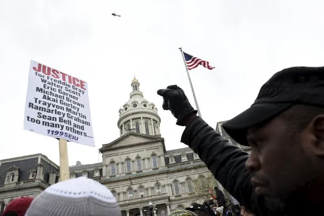 Demonstrators gather in front of City Hall to protest against the death of Freddie Gray in police custody, in Baltimore April 25, 2015. (Photo by Sait Serkan Gurbuz/Reuters)