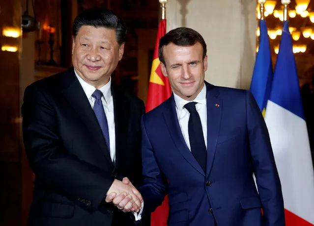 French President Emmanuel Macron shakes hands with Chinese President Xi Jinping as he arrives for a dinner at the Villa Kerylos in Beaulieu-sur-Mer, near Nice, France March 24, 2019. (Photo by Jean-Paul Pelissier/Reuters/Pool)