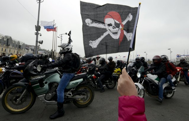 Participants ride their bikes as they celebrate the opening of a new bikers' season in the Russian far eastern city of Vladivostok, May 2, 2015. (Photo by Yuri Maltsev/Reuters)