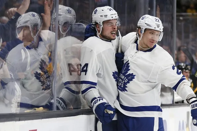 Toronto Maple Leafs' Auston Matthews (34) celebrates his goal with teammate Nikita Zaitsev (22) during the third period in Game 5 of an NHL hockey first-round playoff series against the Boston Bruins in Boston, Friday, April 19, 2019. (Photo by Michael Dwyer/AP Photo)
