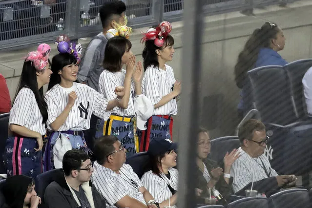 Members of the Japanese pop group Momoiro Clover Z dance before the start of the seventh inning of a baseball game between the New York Yankees and the San Diego Padres, Tuesday, May 28, 2019, in New York. New York Yankees starting pitcher Masahiro Tanaka has walked out to music from the four-woman idol group since coming to the Major League in 2014. (Photo by Julio Cortez/AP Photo)