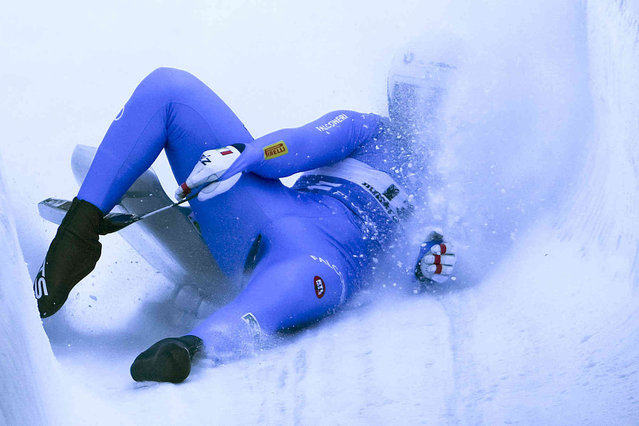 Dominik Fischnaller crashes during the men's sprint race at the Luge World Cup in Igls near Innsbruck, Austria, Sunday, December 19, 2021. (Photo by Matthias Schrader/AP Photo)