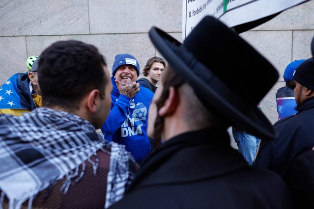 Supporters of Israel (back) argue with pro-Palestinian Orthodox Jewish men as they demonstrate outside Columbia University while pro-Palestinian protests continue on the campus in New York on April 25, 2024. Tensions flared between pro-Palestinian student protesters and school administrators at several US universities on April 22, as in-person classes were cancelled and demonstrators arrested. (Photo by Kena Betancur/AFP Photo)