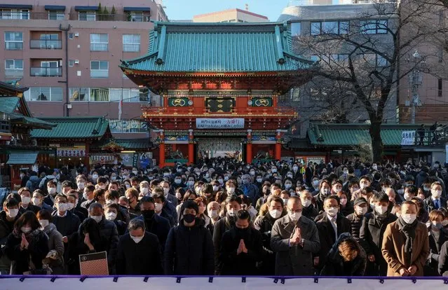 People visit Kanda Myojin Shrine to offer New Year prayers in Tokyo on January 4, 2022, on the first business day of the year. (Photo by Kazuhiro Nogi/AFP Photo)