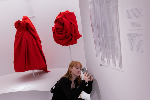 A visitor takes a photo during the press preview of the Costume Institute exhibit “Sleeping Beauties: Reawakening Fashion” at the Metropolitan Museum of Art in Manhattan in New York City, on May 6, 2024. (Photo by Jeenah Moon/Reuters)