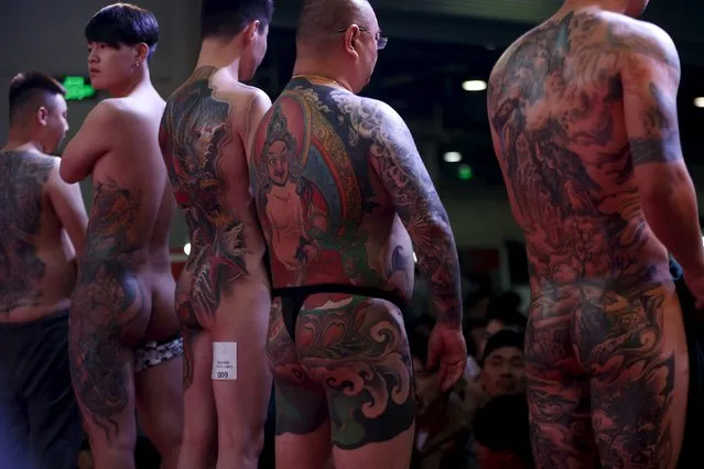 Participants compete in a tattoo contest during an exhibition of 2016 Shanghai International Art Festival Of Tattoos in Shanghai, China, April 23, 2016. (Photo by Aly Song/Reuters)