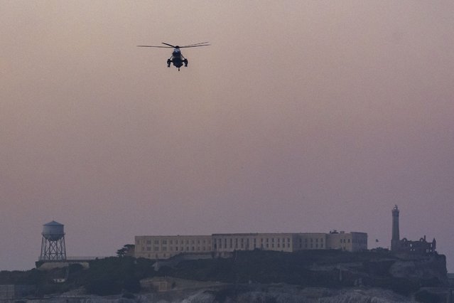 Marine One, with President Joe Biden aboard, flies over Alcatraz Island on approach for a landing at Marina Green parking lot, Thursday, May 9, 2024, in San Francisco. (Photo by Alex Brandon/AP Photo)