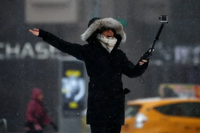 A woman takes a selfie in Times Square during a snow storm in Manhattan, New York, U.S., March 14, 2017. (Photo by Carlo Allegri/Reuters)