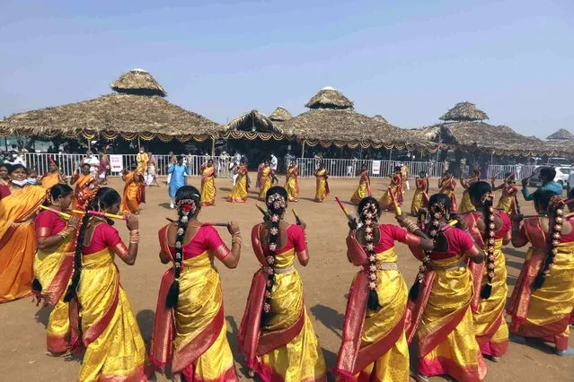 Hindu devotees perform traditional dance inside the premises of a giant statue of 11th-century social reformer and saint, Ramanujacharya that has been named “Statue of Equality” is seen on the outskirts of Hyderabad, India, Thursday, February 3, 2022. The statue will be inaugurated by Narendra Modi, India's prime minister on Feb. 5, 2022. (Photo by Mahesh Kumar A./AP Photo)