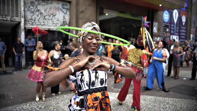 Clowns and circus performers take part in a procession in downtown Sao Paulo as part of the Circus Day celebrations on March 27, 2023. (Photo by Cris Faga/Rex Features/Shutterstock)