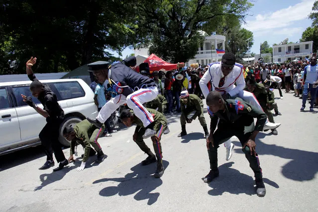 Haitian youths are pictured during celebrations for celebrate Haiti's national flag day in the streets of Arcahaie, Haiti, May 18, 2016. (Photo by Andres Martinez Casares/Reuters)